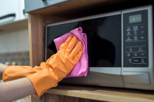 Woman While Cleaning Surface Kitchen Desk With Sponge Her Rubber Gloves Housework 1