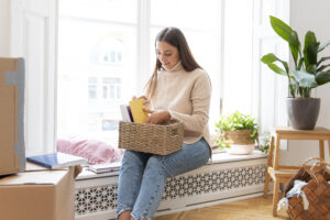 medium shot woman arranging books