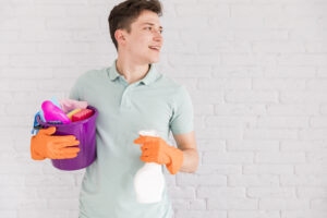 portrait man cleaning his house 2